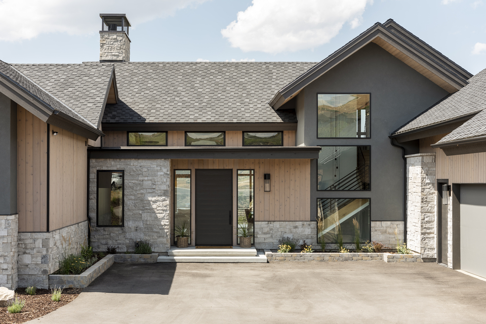 Outside of modern mountain farmhouse by Christa Pirl