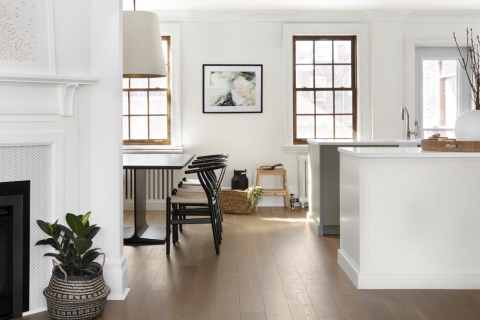 White living room and open concept kitchen with dining in modern designed home